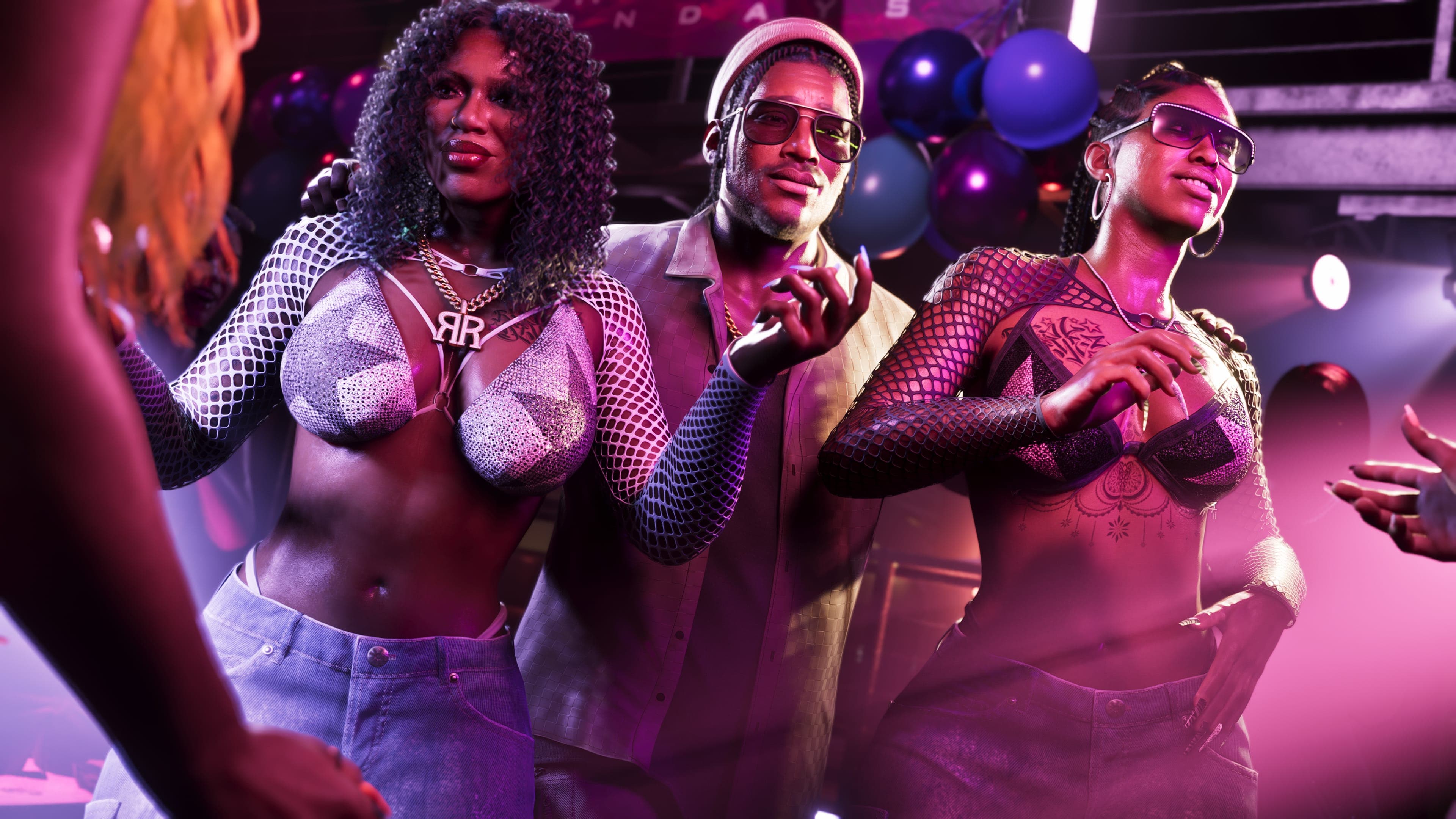 Dre'Quan Priest with the Real Dimez duo in a crowded club under magenta light