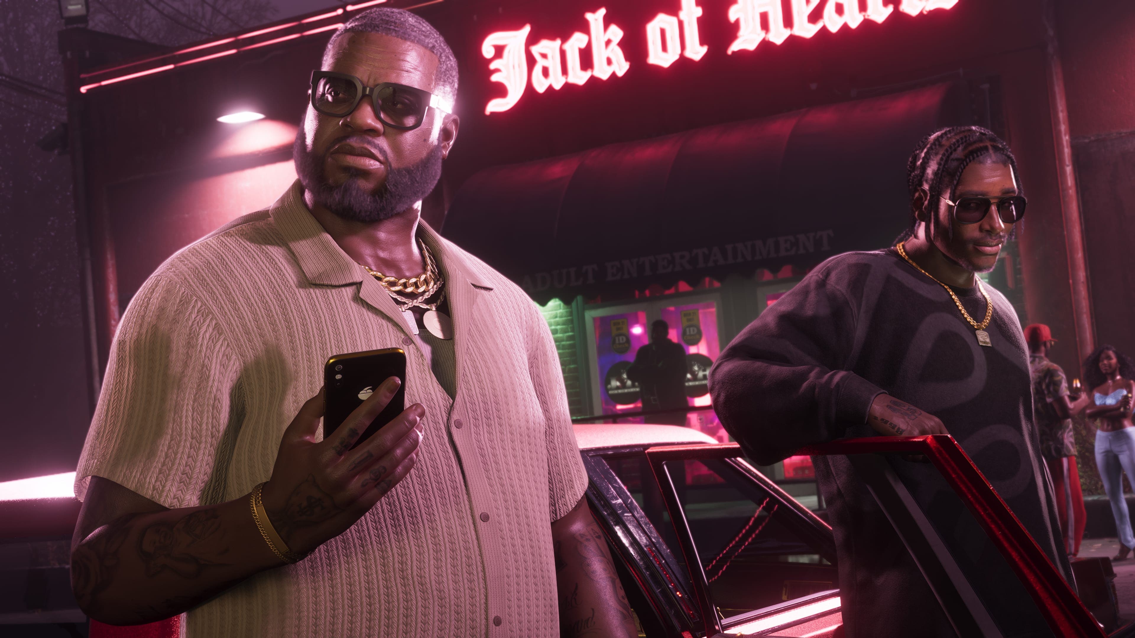 Boobie Ike checking his phone outside the Jack of Hearts club
