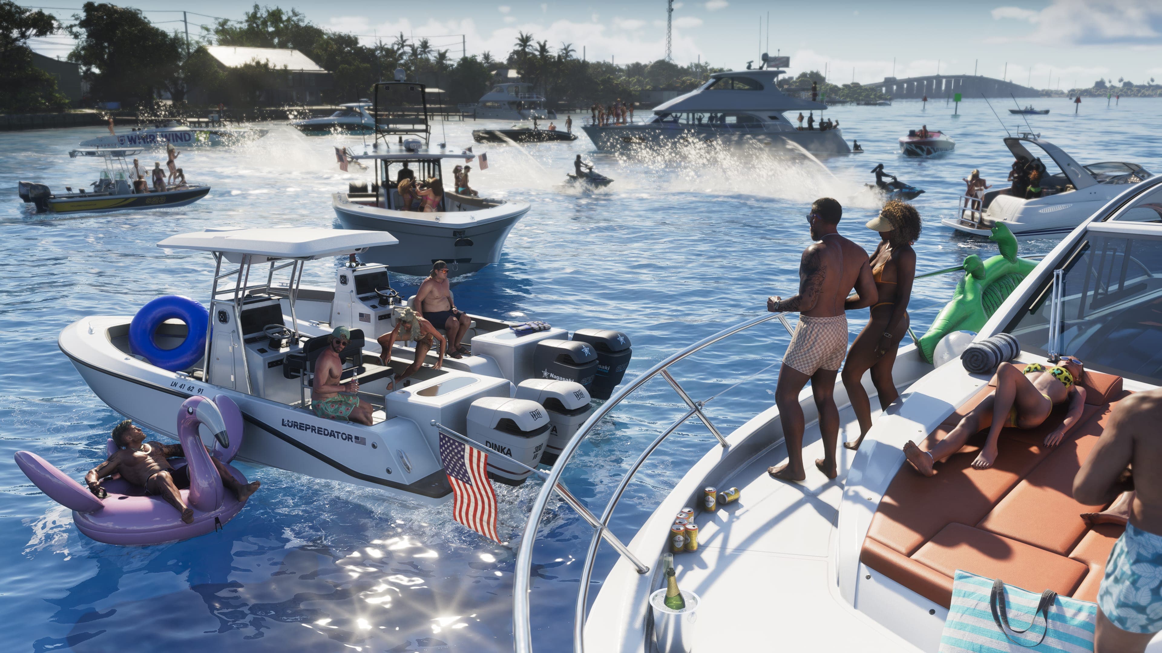 Boats rafted together at a sandbar party, people swimming and sitting on inflatables between them
