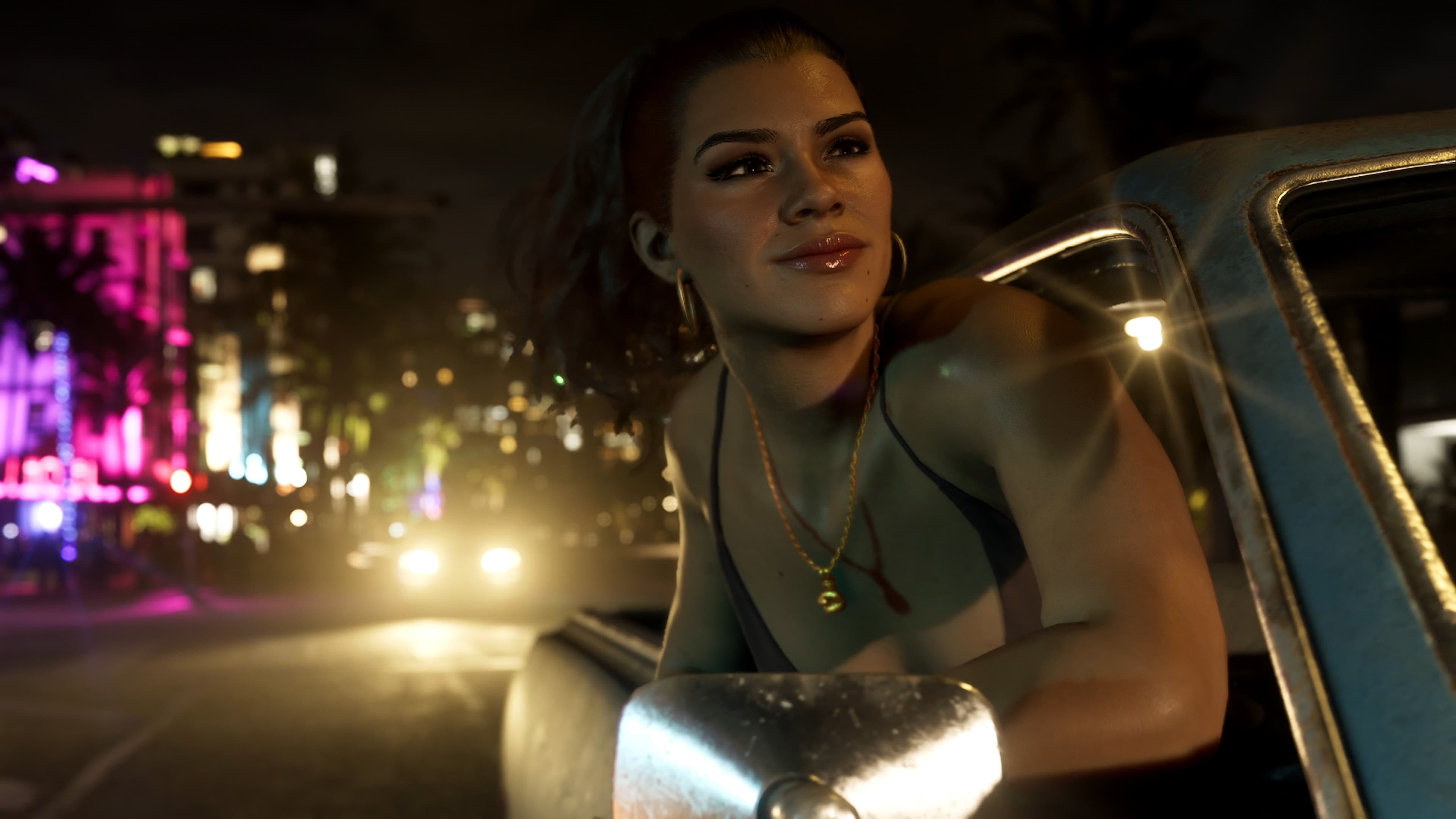 Lucia Caminos leaning out of a car window on a neon-lit street at night