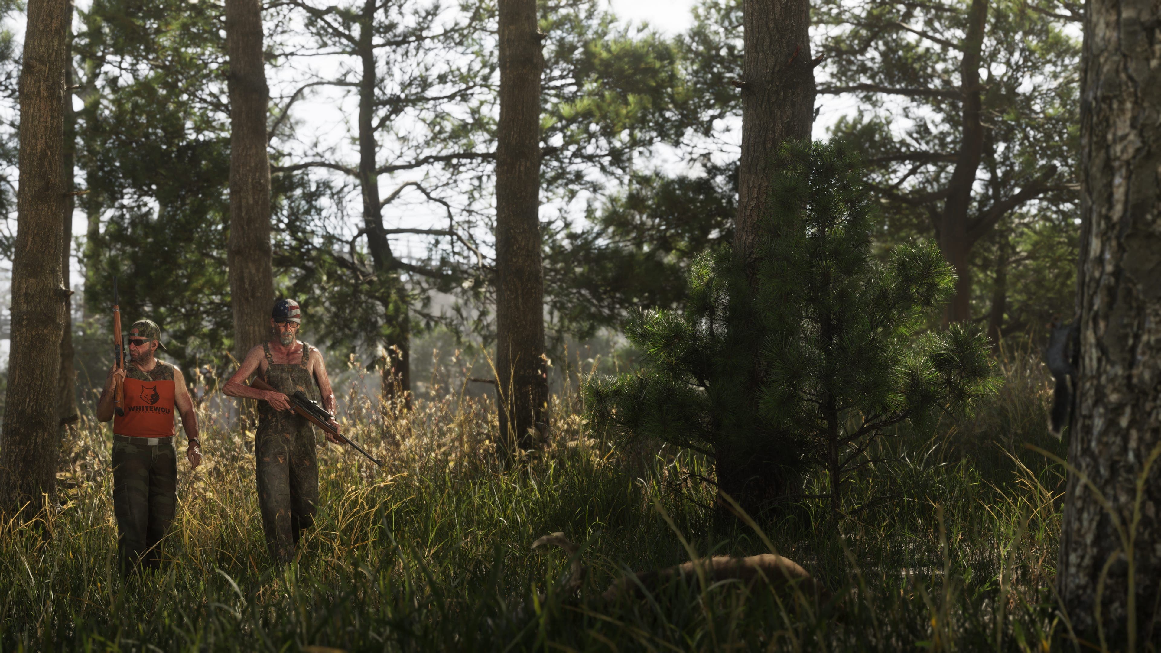 Three hunters with rifles moving through tall grass in a pine forest
