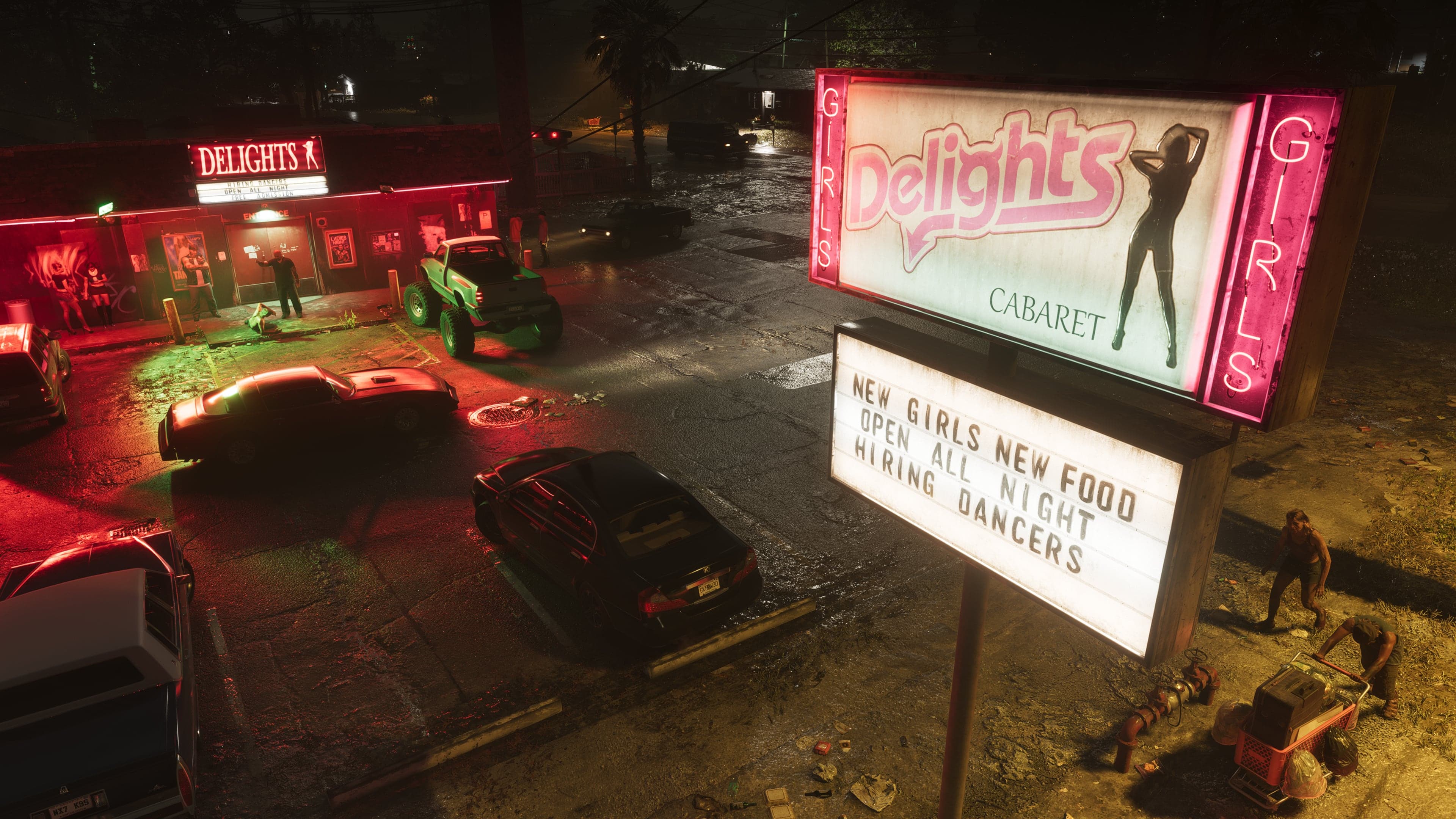 The neon Delights Cabaret sign at night above a car park, reading 'New Girls, New Food'