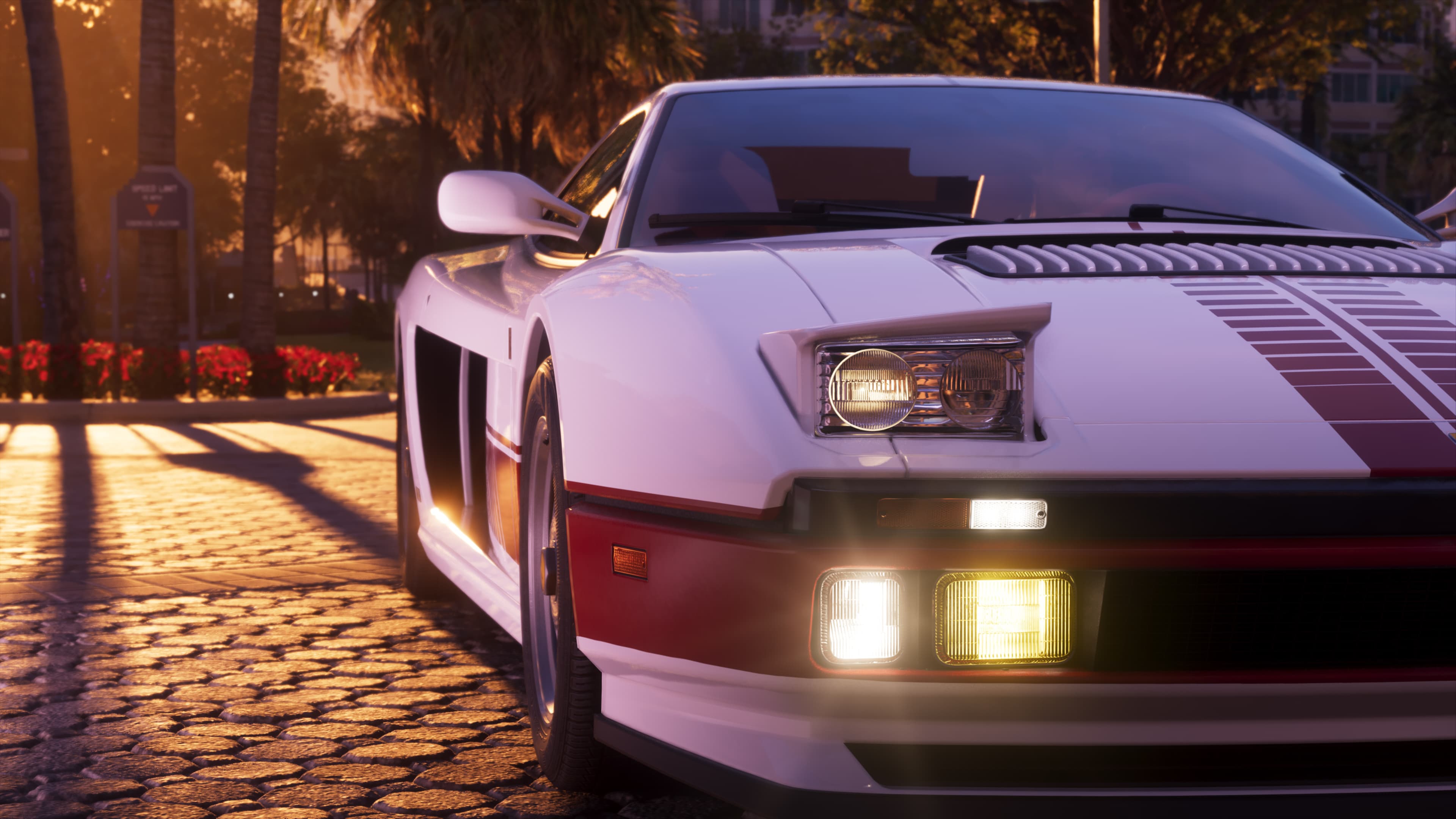 Front three-quarter view of the white Grotti Cheetah with pop-up headlights raised on a palm-lined street