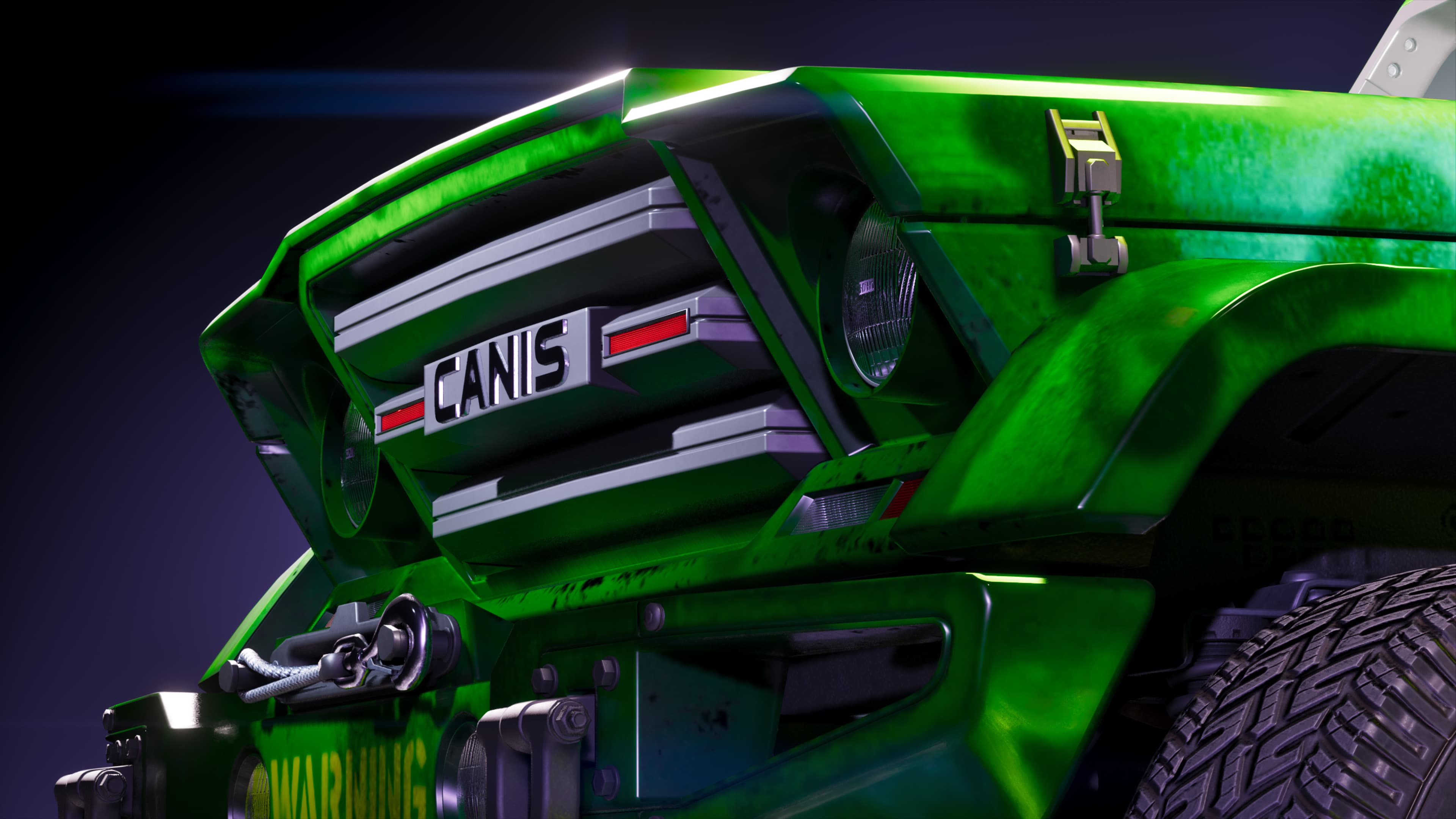 Close front detail of the green Canis truck's grille and CANIS badge