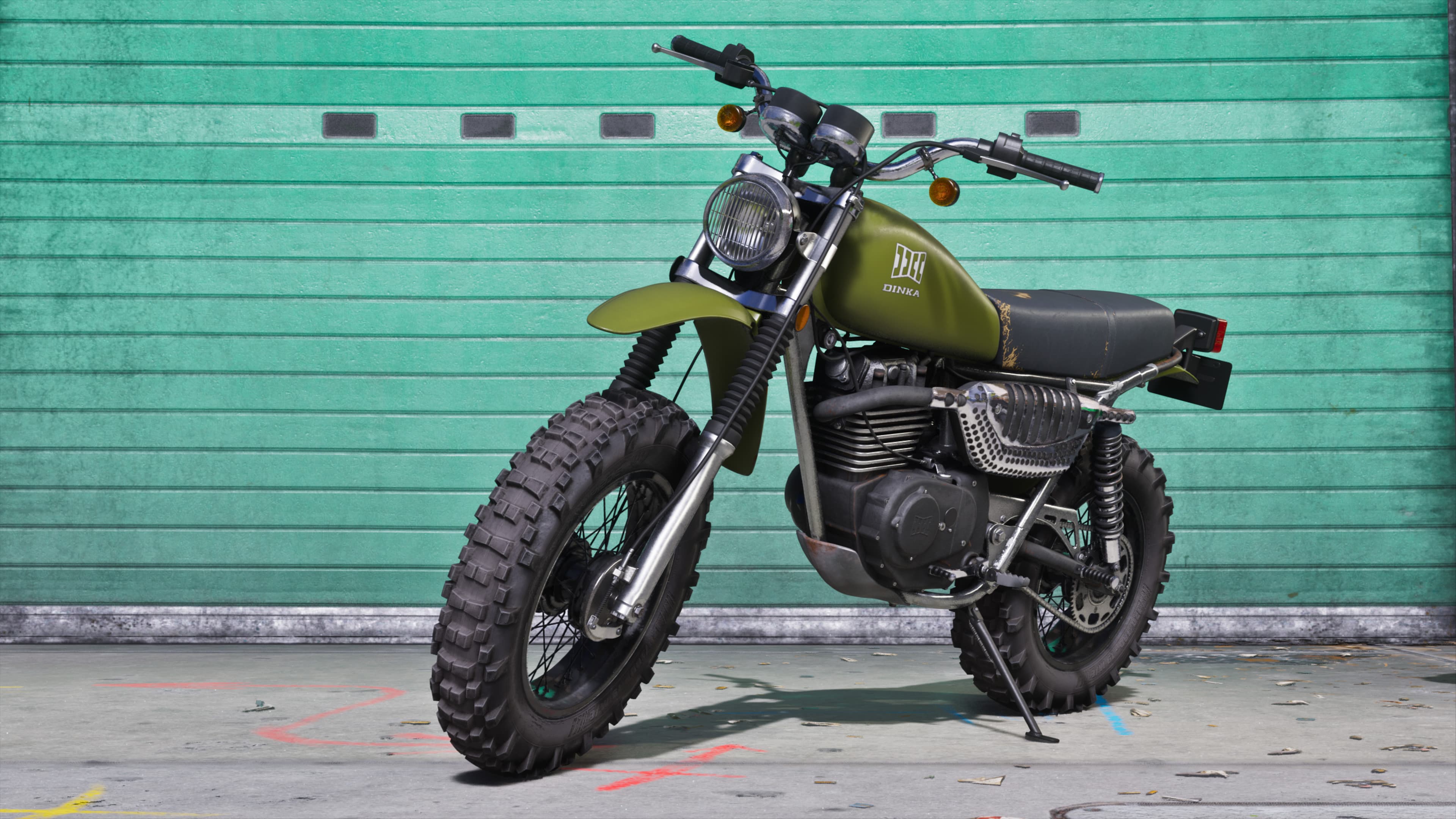 An olive dirt bike photographed side-on against a green corrugated wall