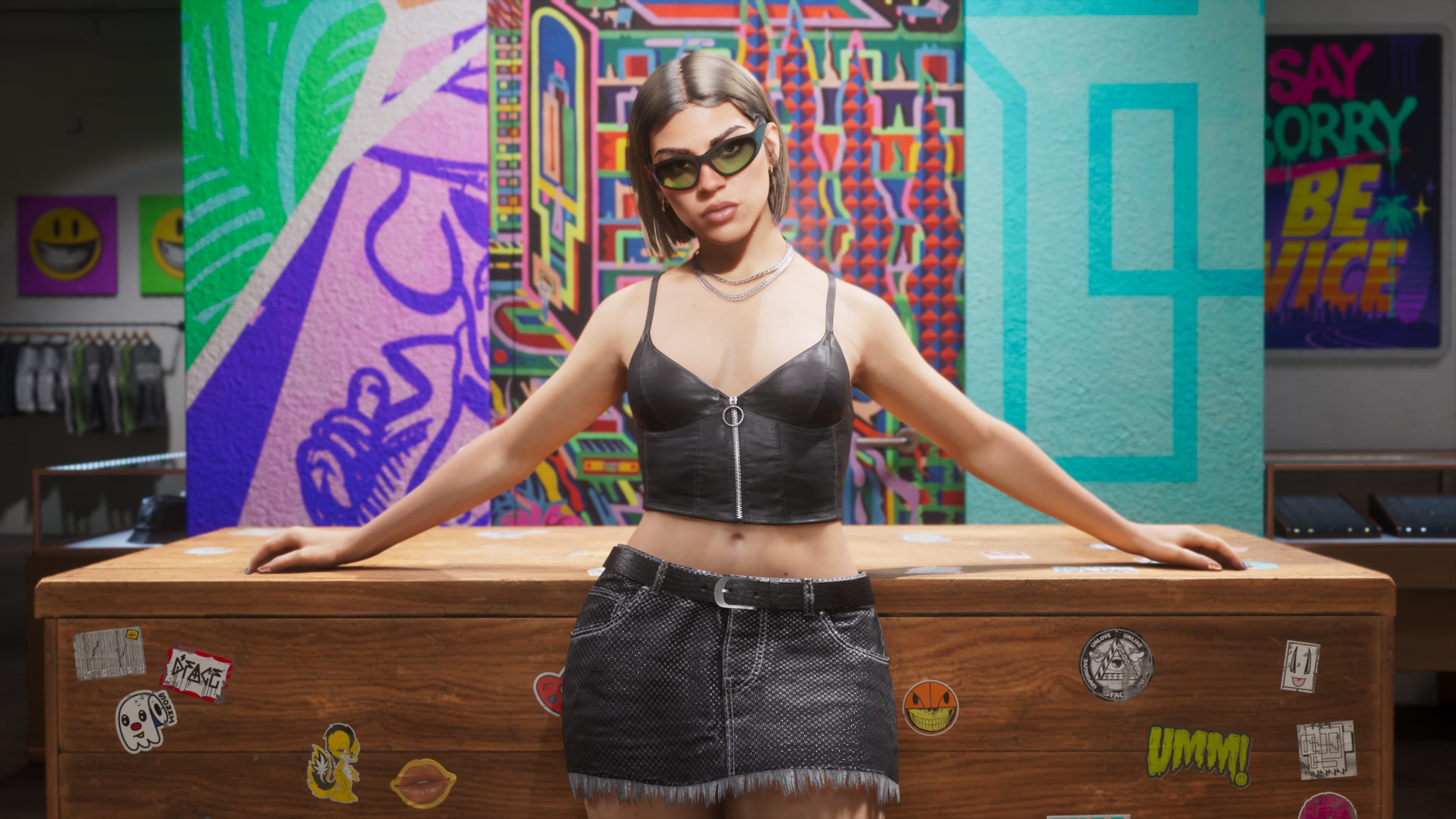 A woman behind the counter of a streetwear store painted with murals