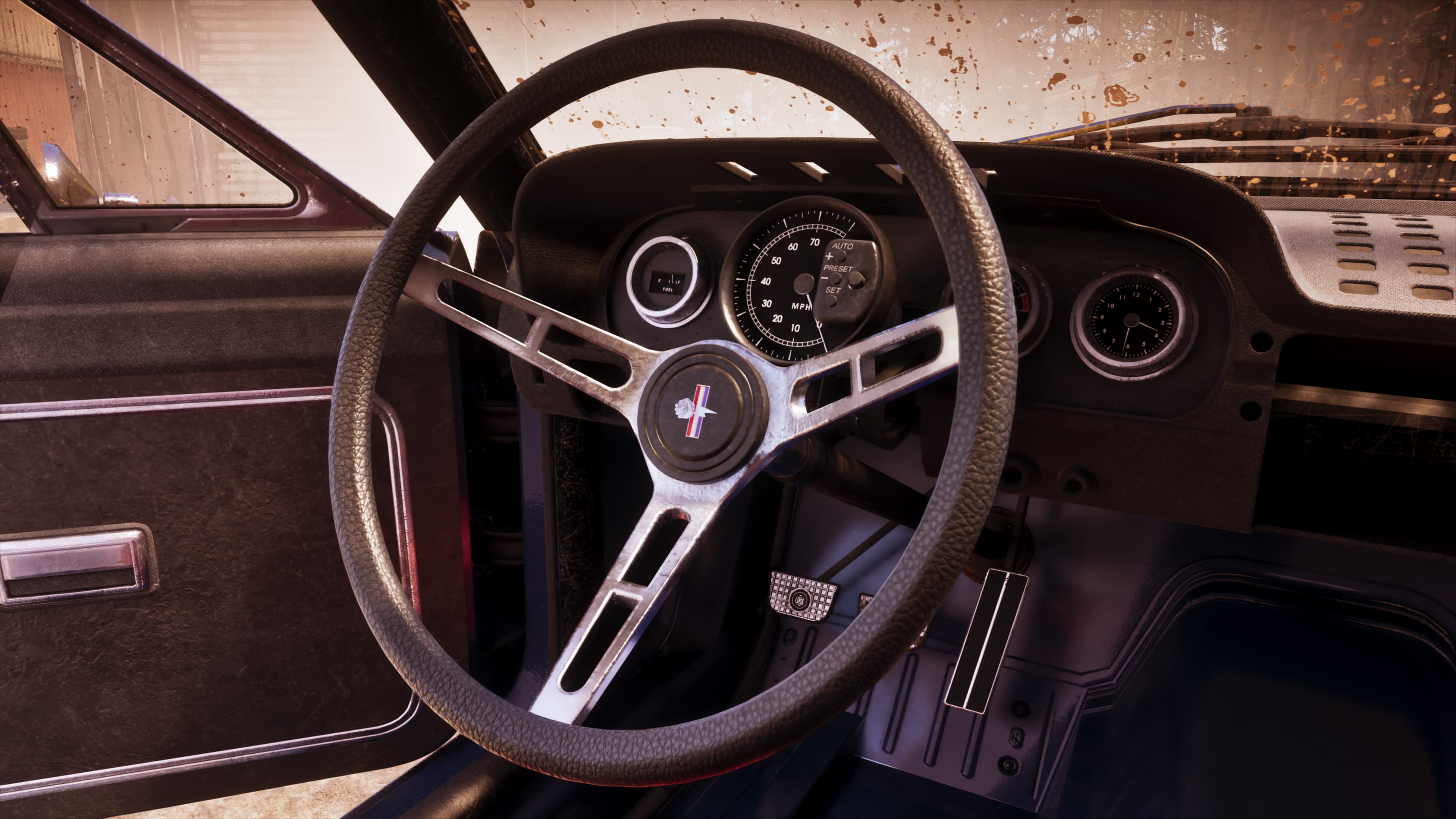 The buggy's stripped interior, showing a three-spoke wheel and analogue dials