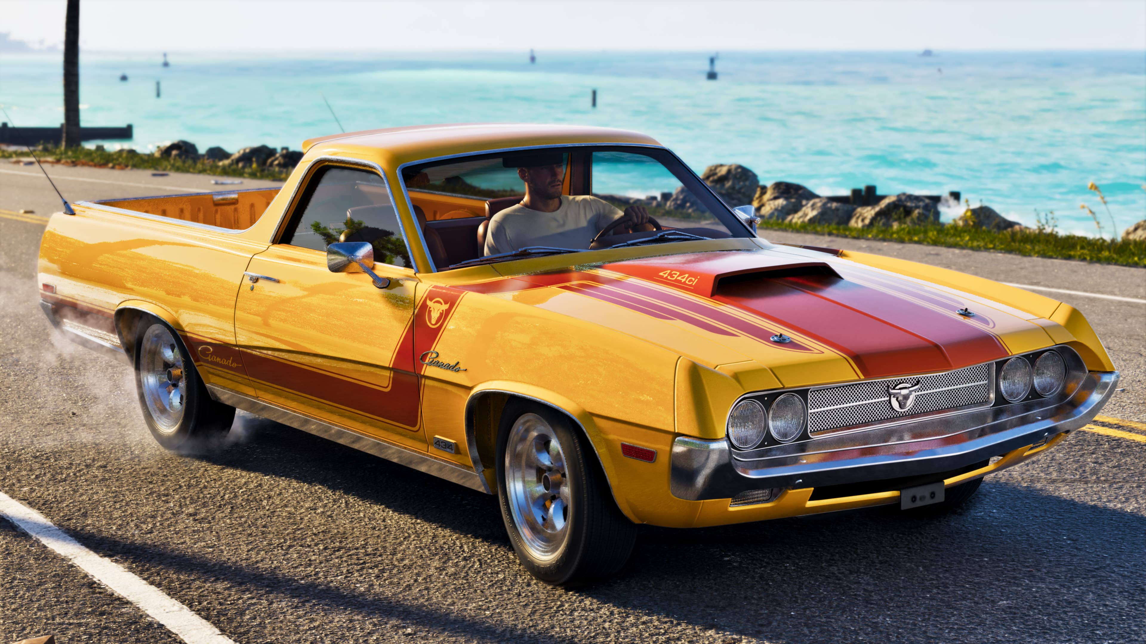 A yellow and orange retro coupe-pickup parked on a coastal road above turquoise water