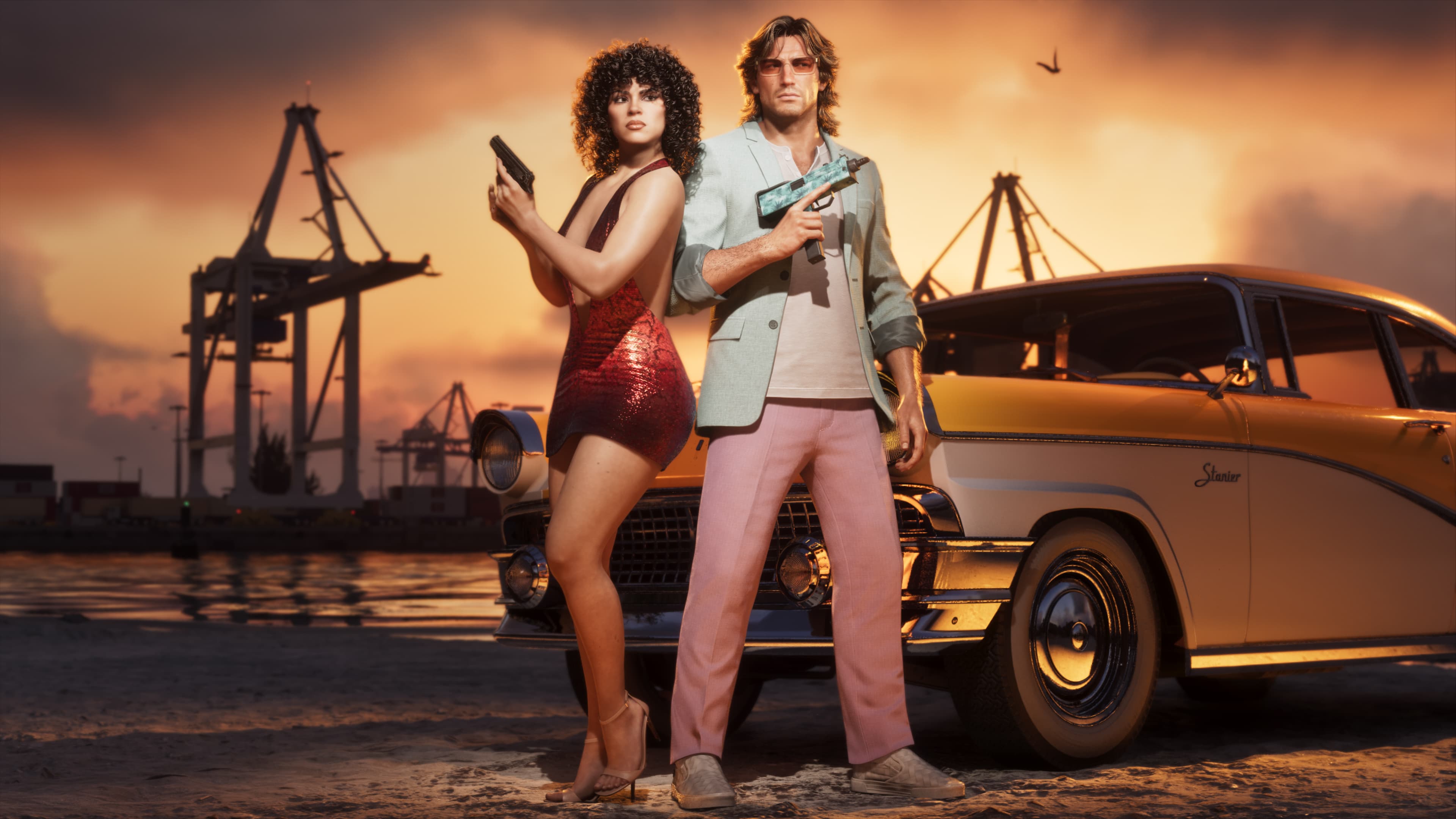 A couple standing beside a yellow classic sedan at the docks at sunset
