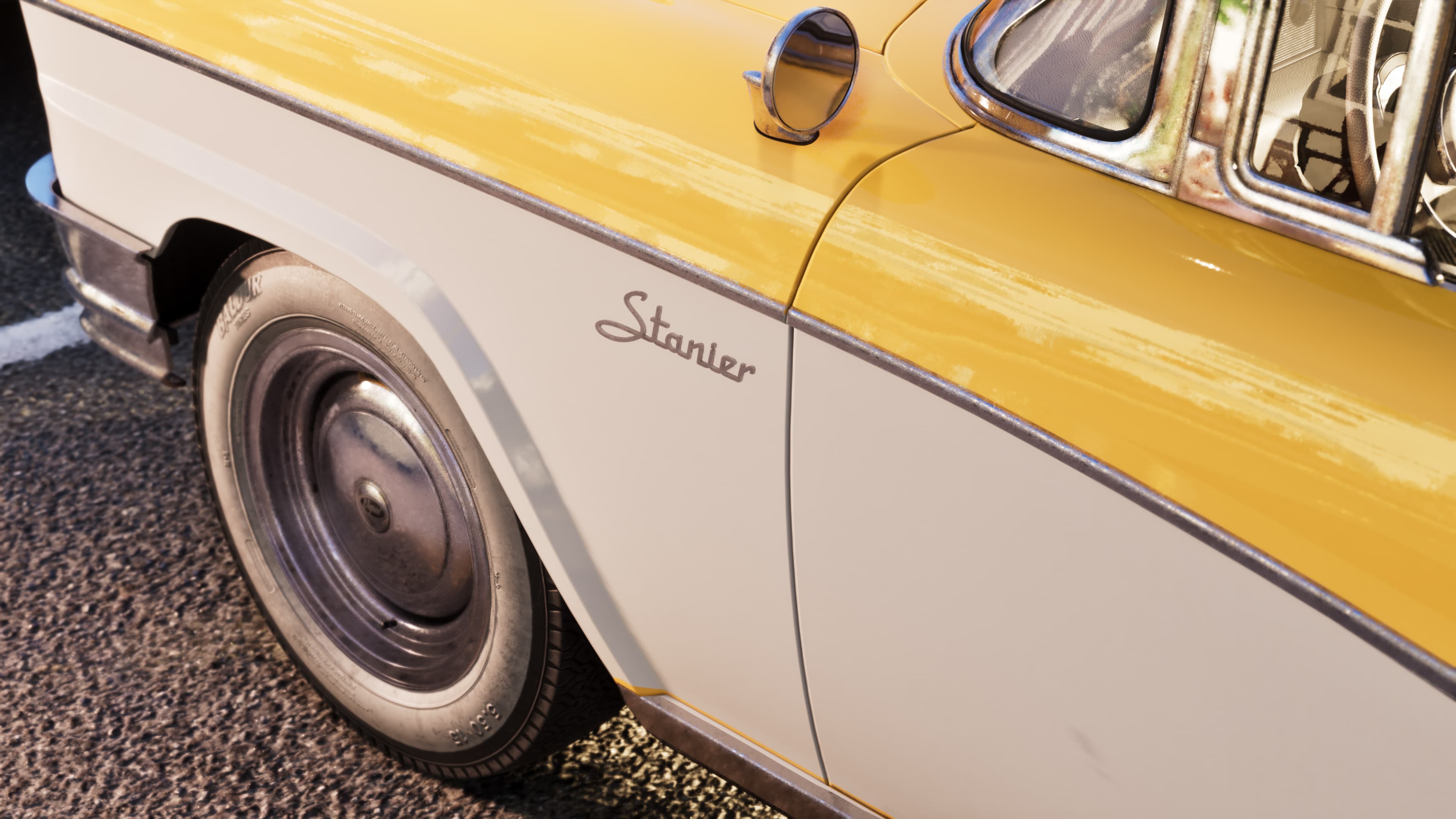 Wheel and side detail of the Stanier showing its chrome trim and script badge